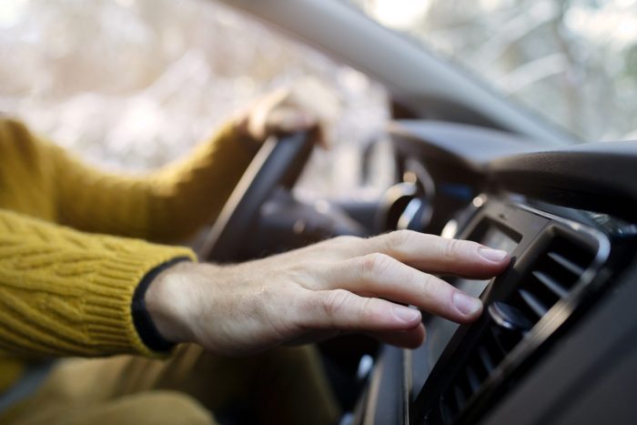 close up hand holding steering wheel 1