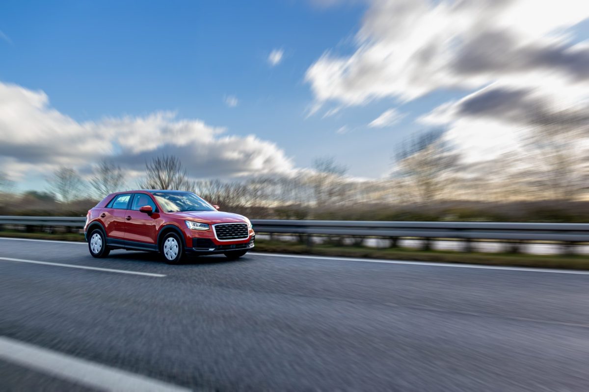 red crossover speeds highway clouds road dynamics